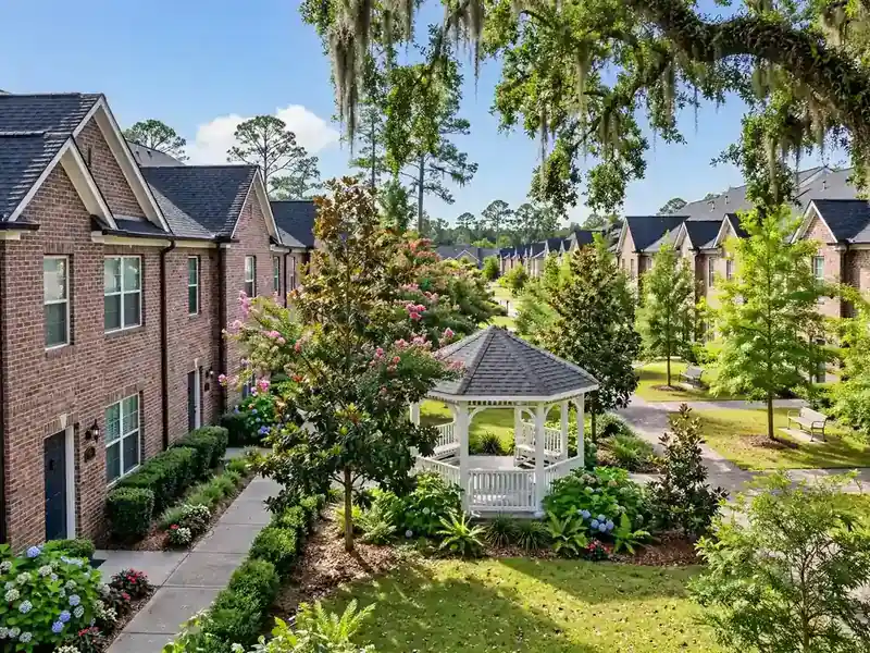 Village-style townhomes around a shared green in Plum Point Villages, Southaven MS